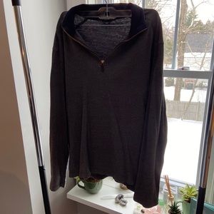 Gray quarter zip sweater.